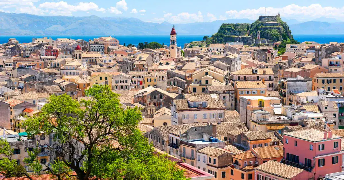 realistic photo of a town during dayling with lush greens and houses