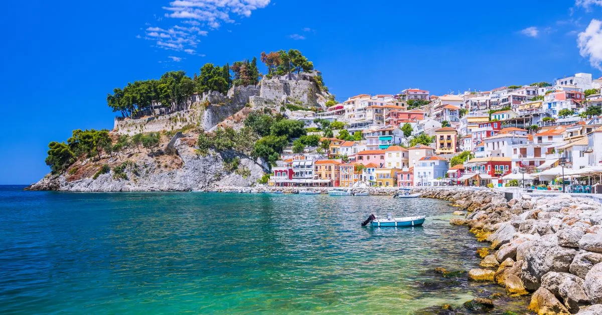 panoramic view of Parga's port during the morning featuring colorfull houses and crystal clear waters